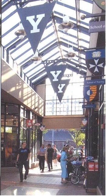 Indoor shopping area with Yale University banners hanging from the ceiling
